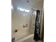 Clean bathtub with a black and white floral shower curtain and a small window above the showerhead at 527 Travelers Blvd, Summerville, SC 29485