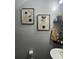 Stylish bathroom with modern art, floating shelves, and a sleek pedestal sink at 527 Travelers Blvd, Summerville, SC 29485