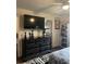Spacious bedroom with a large television mounted above a black dresser with ample storage at 527 Travelers Blvd, Summerville, SC 29485