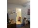 View from the bedroom into the bathroom with vanity, toilet and kid-friendly decorations on the wall at 527 Travelers Blvd, Summerville, SC 29485