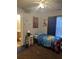 Bright bedroom featuring colorful character-themed bedding, neutral paint and a view into the bathroom at 527 Travelers Blvd, Summerville, SC 29485
