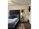 Comfortable bedroom featuring a tufted headboard, plush bedding and a modern nightstand with a lamp at 527 Travelers Blvd, Summerville, SC 29485