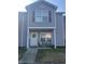 Charming two-story home with a welcoming front porch featuring comfortable seating and a decorative wreath at 527 Travelers Blvd, Summerville, SC 29485