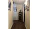 Well-lit hallway featuring a shelving unit with decorative items and framed artwork at 527 Travelers Blvd, Summerville, SC 29485