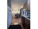 Functional kitchen with stainless steel sink and ample counter space with a view into dining area at 527 Travelers Blvd, Summerville, SC 29485