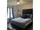 Comfortable main bedroom featuring a bed with a tufted headboard and patterned bedding at 527 Travelers Blvd, Summerville, SC 29485