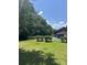 Community backyard with a sparkling pool and well-maintained landscaping at 531 Travelers Blvd, Summerville, SC 29485