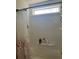 Bright bathroom with a shower featuring a floral curtain and shower caddy at 531 Travelers Blvd, Summerville, SC 29485