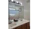 Bathroom with double sinks, mirror, and a floral shower curtain at 531 Travelers Blvd, Summerville, SC 29485