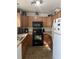 Functional kitchen with modern appliances, warm wood cabinetry, and efficient layout at 531 Travelers Blvd, Summerville, SC 29485