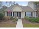 Charming single-story home featuring a welcoming front porch and well-maintained landscaping at 600 Elm Hall Cir, Summerville, SC 29483