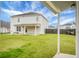 Large backyard with covered patio and green grass at 619 Ravens Wood Rd, Summerville, SC 29486
