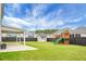 Large backyard with playset and covered patio at 619 Ravens Wood Rd, Summerville, SC 29486