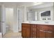 Bathroom features a double sink vanity, a shower, and a toilet with a door to the bedroom at 619 Ravens Wood Rd, Summerville, SC 29486