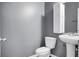 Bathroom featuring a pedestal sink, toilet, and storage shelves at 619 Ravens Wood Rd, Summerville, SC 29486