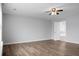 Bright bedroom with hardwood floors, ceiling fan, and an en-suite bathroom at 619 Ravens Wood Rd, Summerville, SC 29486