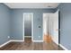 Spacious bedroom with a view of two open doors and vinyl flooring at 619 Ravens Wood Rd, Summerville, SC 29486