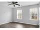 Cozy bedroom featuring a ceiling fan, two windows and neutral paint at 619 Ravens Wood Rd, Summerville, SC 29486