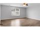 Spacious bedroom featuring natural light, a ceiling fan and hardwood floors at 619 Ravens Wood Rd, Summerville, SC 29486
