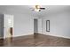 Large bedroom featuring a ceiling fan, hardwood floors, and bathroom access at 619 Ravens Wood Rd, Summerville, SC 29486