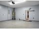 Spacious garage area with epoxy floor, water heater, and access to the kitchen at 619 Ravens Wood Rd, Summerville, SC 29486