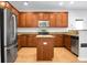 Well-lit kitchen featuring stainless steel appliances, granite countertops, and hardwood floors at 619 Ravens Wood Rd, Summerville, SC 29486