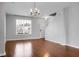 Bright living room features hardwood floors, a large window, and a staircase for easy access at 619 Ravens Wood Rd, Summerville, SC 29486
