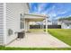 Covered back patio with concrete, perfect for outdoor entertaining and relaxing at 619 Ravens Wood Rd, Summerville, SC 29486