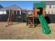 Backyard playground with a slide and swings, perfect for outdoor fun and entertainment at 619 Ravens Wood Rd, Summerville, SC 29486