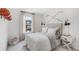 Comfortable bedroom with natural light, decorated with sports-themed accessories and neutral tones at 621 Red Monarch Way, Moncks Corner, SC 29461
