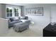 Cozy loft area with a comfortable sectional sofa and large windows, perfect for relaxing at 621 Red Monarch Way, Moncks Corner, SC 29461