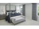 Serene main bedroom featuring a four-poster bed and soft, neutral tones at 621 Red Monarch Way, Moncks Corner, SC 29461
