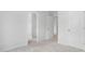 Cozy bedroom with neutral carpet and freshly painted walls with access to other rooms at 629 Red Monarch Way, Moncks Corner, SC 29461
