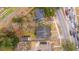 An overhead shot highlighting homes, driveways, and a road with vehicle traffic at 69 Folly Road Blvd, Charleston, SC 29407
