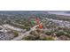 An aerial view of a house in a treed neighborhood, blending natural beauty and residential living at 69 Folly Road Blvd, Charleston, SC 29407