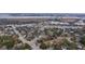 Bird's-eye view of a charming neighborhood blending residential and commercial areas with distant waterfront at 69 Folly Road Blvd, Charleston, SC 29407