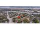 Scenic aerial view of a home nestled among trees near roadways, showcasing neighborhood charm at 69 Folly Road Blvd, Charleston, SC 29407