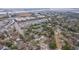 A dynamic aerial view showcases the property's location near urban amenities and water at 69 Folly Road Blvd, Charleston, SC 29407