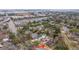 An aerial view shows the home nestled among lush greenery in a quiet neighborhood at 69 Folly Road Blvd, Charleston, SC 29407
