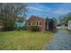 Charming brick home with a spacious backyard and screened porch, perfect for outdoor living at 69 Folly Road Blvd, Charleston, SC 29407
