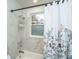 Bright bathroom featuring a shower/tub combo and a floral shower curtain at 69 Folly Road Blvd, Charleston, SC 29407