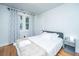 Comfortable bedroom with a modern bed, light walls, and hardwood floors at 69 Folly Road Blvd, Charleston, SC 29407