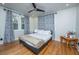 Cozy bedroom with a modern bed, hardwood floors, and natural light from the window at 69 Folly Road Blvd, Charleston, SC 29407