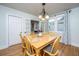 Inviting dining room featuring a wooden table with seating for six, hardwood floors, and a view into another room at 69 Folly Road Blvd, Charleston, SC 29407