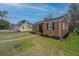 Charming single story brick home featuring a new roof and manicured landscape at 69 Folly Road Blvd, Charleston, SC 29407