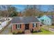 Attractive brick home featuring a classic design and manicured landscaping at 69 Folly Road Blvd, Charleston, SC 29407