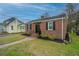 Charming brick home featuring a new roof and well maintained landscape and hardscape at 69 Folly Road Blvd, Charleston, SC 29407