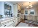 Well-lit kitchen featuring granite countertops, stainless steel appliances, and custom cabinets at 69 Folly Road Blvd, Charleston, SC 29407