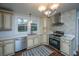 Well-lit kitchen with cream cabinets, stainless steel appliances, modern countertops, and a stylish tile backsplash at 69 Folly Road Blvd, Charleston, SC 29407