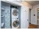 Convenient laundry area featuring a stacked washer and dryer and shelving at 69 Folly Road Blvd, Charleston, SC 29407